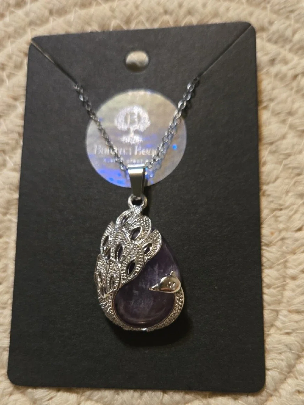 Silver Peacock Pendant Necklace with Purple Teardrop Gem